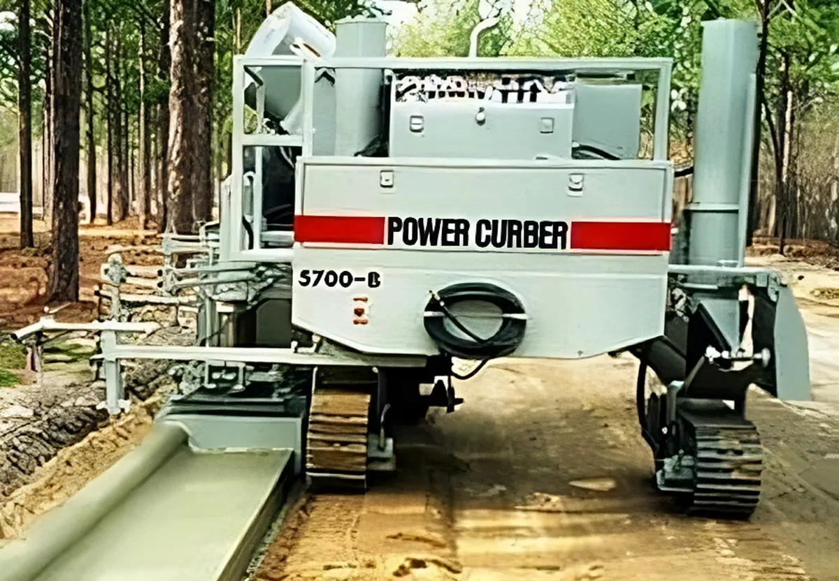 Power Curbers 5700-B curbing machine paving a sidewalk